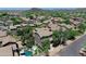 Aerial view of home and community highlighting the pool, landscaping, and mountain backdrop at 35202 N 30Th Dr, Phoenix, AZ 85086