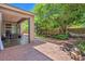Serene backyard featuring a covered patio, pergola-shaded retreat, and meticulously designed garden spaces offers relaxation at 35202 N 30Th Dr, Phoenix, AZ 85086