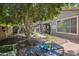 Serene backyard featuring mature trees, covered patio and plenty of room for outdoor enjoyment at 35202 N 30Th Dr, Phoenix, AZ 85086