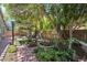 Lush backyard features a pergola, garden, and mature trees, creating a peaceful and private outdoor retreat at 35202 N 30Th Dr, Phoenix, AZ 85086