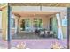 Spacious covered patio with outdoor seating areas transitions seamlessly from indoor living with access via sliding glass doors at 35202 N 30Th Dr, Phoenix, AZ 85086