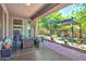 Relaxing covered patio with outdoor seating, fire pit, pergola, and garden provides shade and ambiance at 35202 N 30Th Dr, Phoenix, AZ 85086