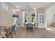 Bright dining area with modern table and seating, complemented by cheerful string lights at 35202 N 30Th Dr, Phoenix, AZ 85086
