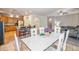 Bright open floor plan with kitchen island, dining area, and living room with stylish modern furniture at 35202 N 30Th Dr, Phoenix, AZ 85086
