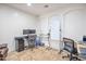 Well-lit home office space with a modern desk setup and tile flooring at 35202 N 30Th Dr, Phoenix, AZ 85086
