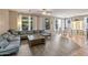 Inviting living room with a comfortable sectional sofa, wood coffee table, and views of the outdoor space at 35202 N 30Th Dr, Phoenix, AZ 85086