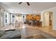 Bright and airy living room that seamlessly transitions to the kitchen with a breakfast bar and adjacent dining area at 35202 N 30Th Dr, Phoenix, AZ 85086