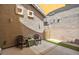 Cozy outdoor patio area with comfortable seating, artificial turf, and shade at 35202 N 30Th Dr, Phoenix, AZ 85086