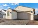 Single Gathering home featuring a neutral color palette, a two-car garage, and a nicely paved driveway at 4430 N 203Rd Dr, Buckeye, AZ 85396