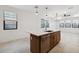 Bright kitchen with a large island, stainless steel dishwasher, modern fixtures, and open layout at 4430 N 203Rd Dr, Buckeye, AZ 85396