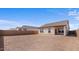 Spacious backyard with an installed patio and privacy wall in a new home construction at 16625 N Lunar St, Maricopa, AZ 85138