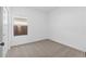 Simple bedroom with neutral carpet and one window at 16625 N Lunar St, Maricopa, AZ 85138