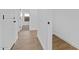 Hallway showcases wood-look flooring and white doors at 16625 N Lunar St, Maricopa, AZ 85138
