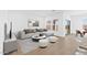 Cozy living room featuring a comfortable sofa, modern art, and sliding glass door at 16625 N Lunar St, Maricopa, AZ 85138