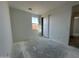 Bright bedroom with a window and sliding closet doors at 22857 E Roundup Way, Queen Creek, AZ 85142