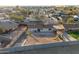 Aerial view of a fenced backyard with hardscape and dirt landscaping, featuring a play structure at 323 N 69Th Ave, Phoenix, AZ 85043