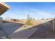 Expansive backyard featuring a playground, spacious patio area, and mature trees at 323 N 69Th Ave, Phoenix, AZ 85043