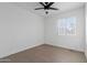 Bright bedroom with ceiling fan, and a large window allows ample natural light at 323 N 69Th Ave, Phoenix, AZ 85043