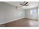 A well-lit bedroom with wood floors, a ceiling fan and ample natural light at 323 N 69Th Ave, Phoenix, AZ 85043