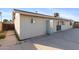 Side view of a home reveals an exterior with painted siding and a view of sliding glass doors at 323 N 69Th Ave, Phoenix, AZ 85043