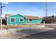 Image of the home highlighting the quaint front yard and exterior paint color at 323 N 69Th Ave, Phoenix, AZ 85043