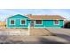 Charming single-story home featuring a colorful exterior, brown roof, and simple landscaping at 323 N 69Th Ave, Phoenix, AZ 85043