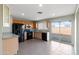 Bright kitchen with sliding glass doors to the backyard and stainless steel appliances at 323 N 69Th Ave, Phoenix, AZ 85043