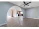 Open-concept layout with an arched entryway, connecting the living area to the kitchen at 323 N 69Th Ave, Phoenix, AZ 85043