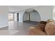 Living space showcasing seamless flow between tiled and wood flooring at 323 N 69Th Ave, Phoenix, AZ 85043