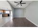 Spacious room featuring a ceiling fan and arched entryway at 323 N 69Th Ave, Phoenix, AZ 85043