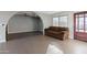Inviting living room with tiled floors, and a large window provides natural light at 323 N 69Th Ave, Phoenix, AZ 85043