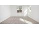 A bedroom with natural lighting, neutral paint, trim, and carpet at 5335 W Manzanita Dr, Glendale, AZ 85302