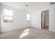 A spacious bedroom with carpet, neutral paint, and lots of natural light at 5335 W Manzanita Dr, Glendale, AZ 85302