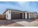 Single-story home featuring brick accents, a two-car garage, and well-maintained landscaping at 5335 W Manzanita Dr, Glendale, AZ 85302