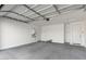 Spacious two car garage with painted walls and floors and neutral colors throughout at 5335 W Manzanita Dr, Glendale, AZ 85302