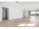 Expansive living area with neutral flooring, recessed lighting, and sliding glass doors leading to the backyard at 5335 W Manzanita Dr, Glendale, AZ 85302