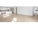 Open-concept layout seamlessly connects the living area to the bright kitchen with stainless steel appliances at 5335 W Manzanita Dr, Glendale, AZ 85302