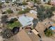 Aerial view of home in a quiet neighborhood with mature trees and ample space for outdoor activities at 26415 S Recker Rd, Queen Creek, AZ 85142