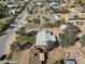 Aerial view of home in a quiet neighborhood with mature trees and desert landscaping at 26415 S Recker Rd, Queen Creek, AZ 85142
