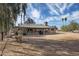 Spacious lot features a covered patio and mature landscaping at 26415 S Recker Rd, Queen Creek, AZ 85142