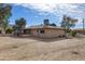 Spacious backyard with covered patio for outdoor entertaining and mature trees at 26415 S Recker Rd, Queen Creek, AZ 85142