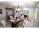 Formal dining room with a wood table and six chairs at 12620 W Parkwood Dr, Sun City West, AZ 85375