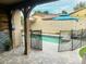 Relaxing pool area with patio, safety fence, and umbrella at 15402 W Old Oak Ln, Surprise, AZ 85379