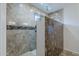 Walk-in shower with tile surround and multiple shower heads at 22142 N Braden Rd, Maricopa, AZ 85138