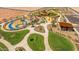 Aerial view of a community park with playground, walking paths, and a pavilion at 1205 W Golden Ore Pass, Apache Junction, AZ 85120
