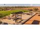 Outdoor picnic area with shaded tables and ping pong tables at 1205 W Golden Ore Pass, Apache Junction, AZ 85120
