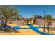 Modern playground with climbing walls, slides, and play structures at 1205 W Golden Ore Pass, Apache Junction, AZ 85120