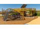 Rope climbing and play structure in a modern playground at 1205 W Golden Ore Pass, Apache Junction, AZ 85120