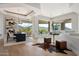 Elegant dining room with mountain views and a modern chandelier at 12943 E Corrine Dr, Scottsdale, AZ 85259