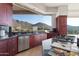 Modern kitchen with granite countertops and mountain views at 12943 E Corrine Dr, Scottsdale, AZ 85259